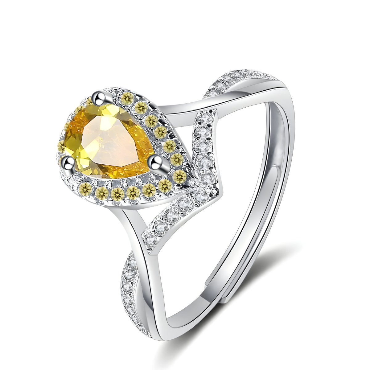 bague citrine vintage avec pierre poire facettée entourée de petits oxydes jaunes et blancs sur monture argentée ajourée