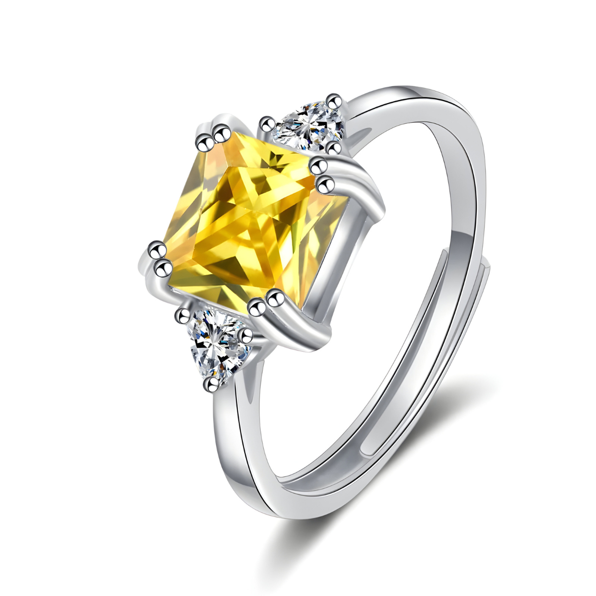 bague citrine argent avec pierre rectangulaire jaune sertie entre deux oxydes blancs en forme de triangle sur anneau argenté