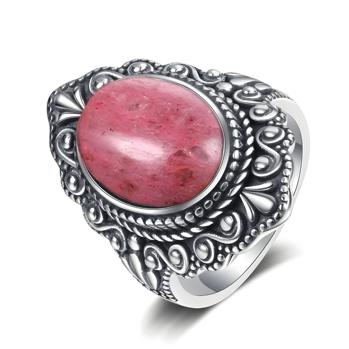 Bague rhodochrosite ovale rose montée sur anneau argenté massif avec monture décorée de motifs sculptés en relief