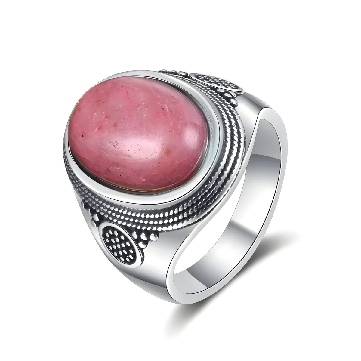 Bague rhodochrosite ovale rose montée sur anneau argenté massif avec monture gravée de motifs perlés et géométriques