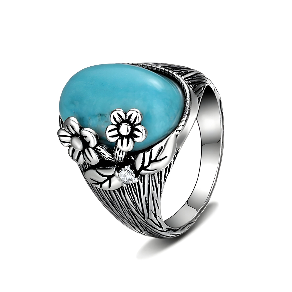 Bague turquoise pierre bleu en argent avec pierre cabochon ovale sertie sur un anneau sculpté décoré de fleurs et feuillage en relief