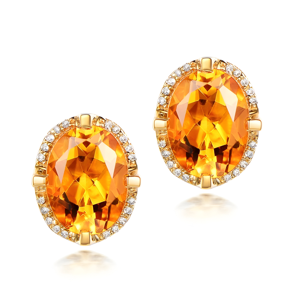boucle d’oreille citrine ovale facettée entourée de petits oxydes monture dorée