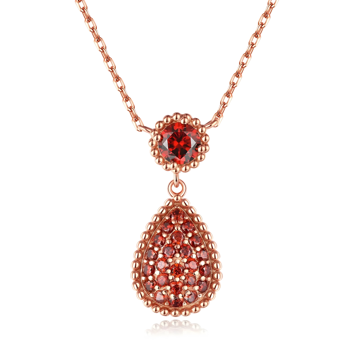 Un collier Grenat en or rose, orné d’une pierre ronde rouge et d’un pendentif en goutte serti de multiples grenats étincelants