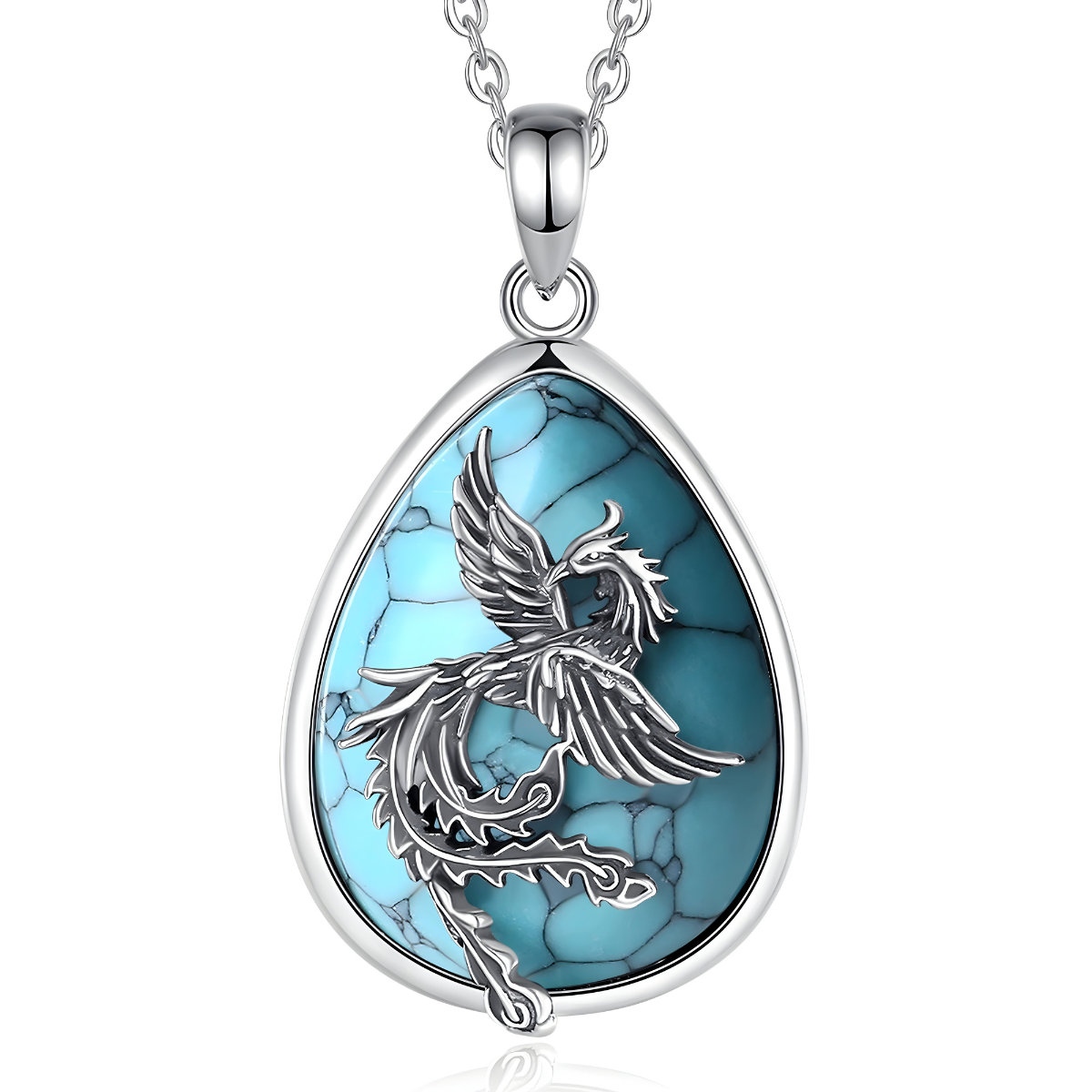 Un Collier Turquoise Argent en forme de goutte, orné d’une pierre turquoise veinée et d’un motif de phénix finement sculpté
