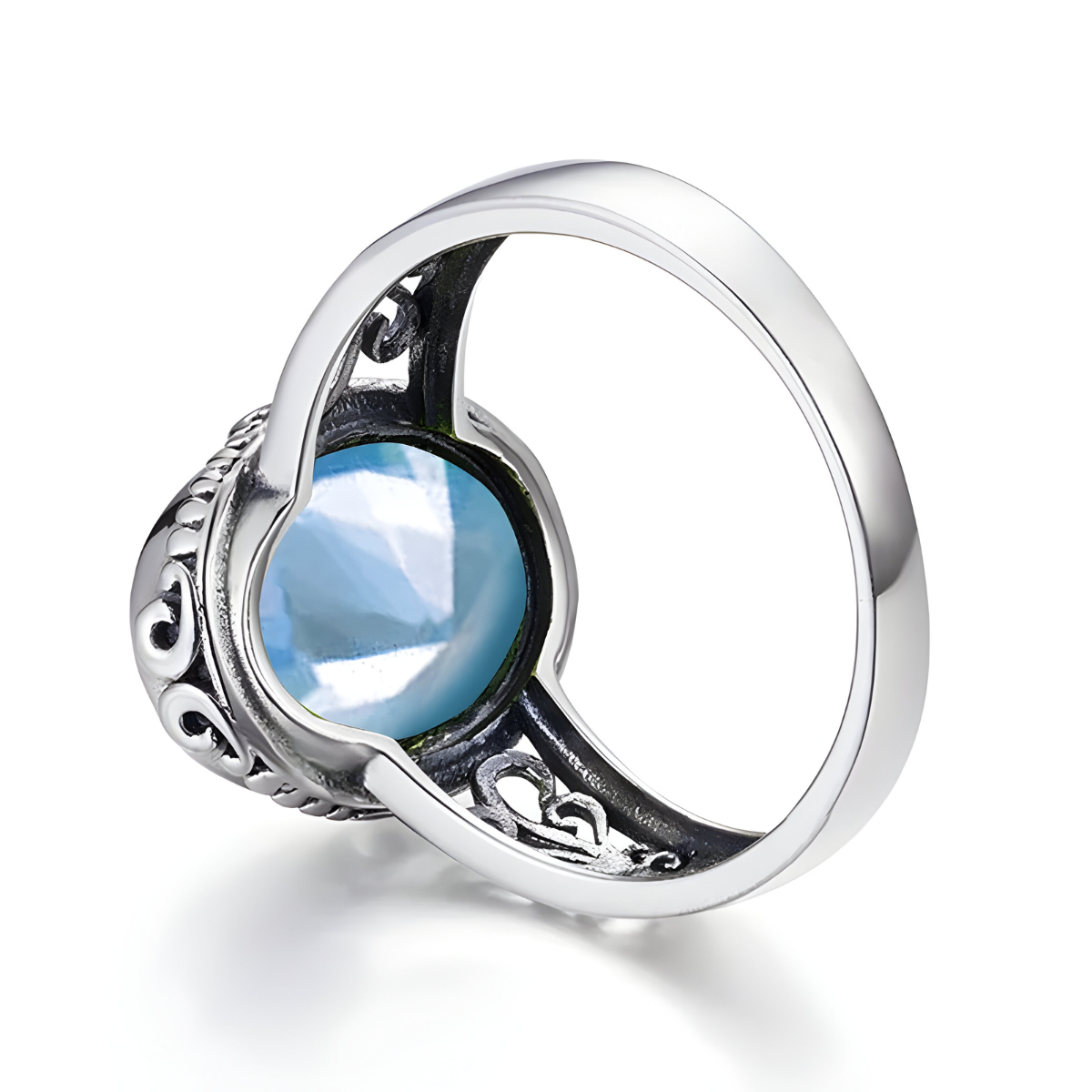 bague aigue marine ovale en argent 925 avec pierre facettée et détails ajourés