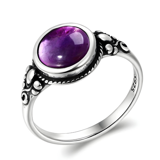 bague améthyste Lithothérapie en argent 925 avec une pierre ovale cabochon et anneau sculpté de motifs vintage