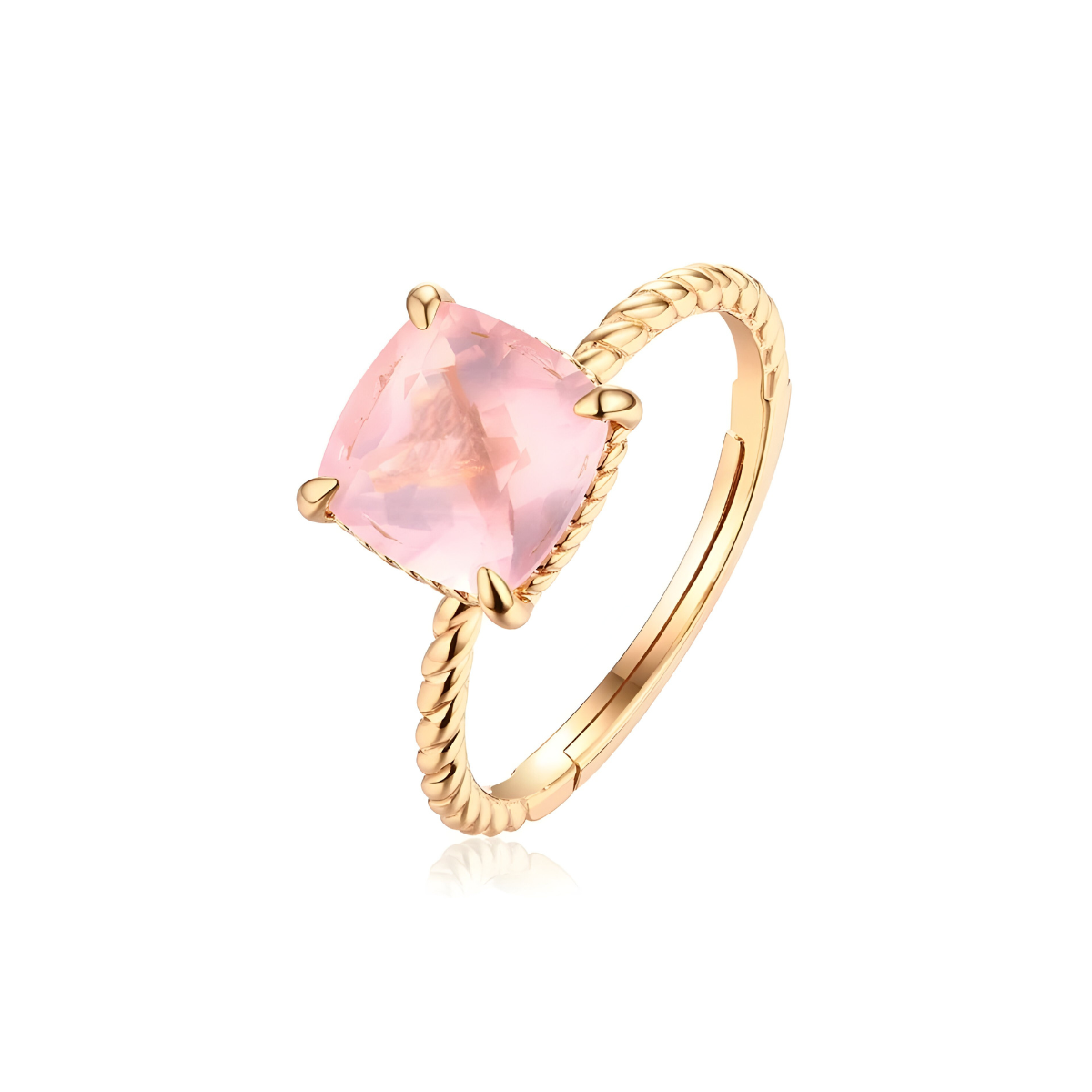 Une Bague Quartz Rose Or en or jaune, ornée d’une pierre rose facettée en forme de coussin et sertie de quatre griffes sur un anneau torsadé
