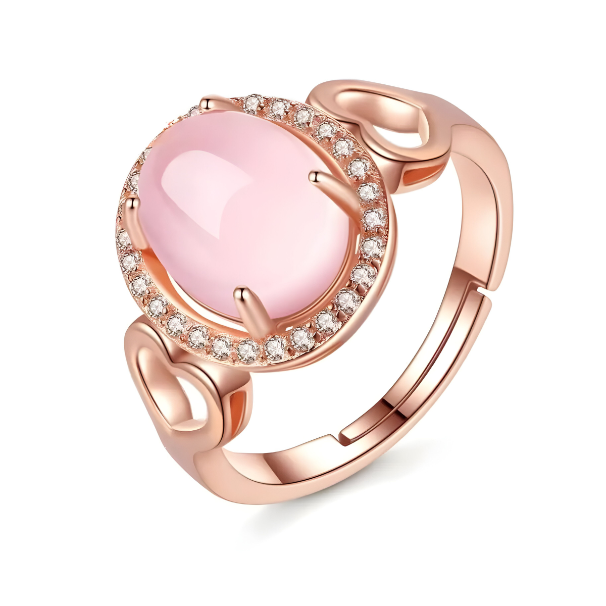 Une Bague Quartz Rose Or en or rose, ornée d’une pierre ovale rose polie entourée d’un halo de petits cristaux