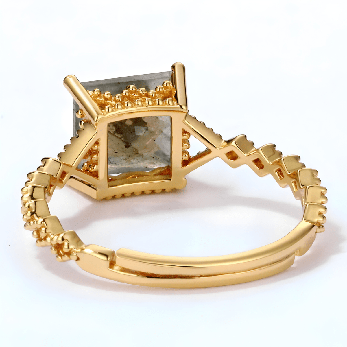 Bague labradorite or avec pierre carrée en serti surélevé et anneau doré orné de détails géométriques
