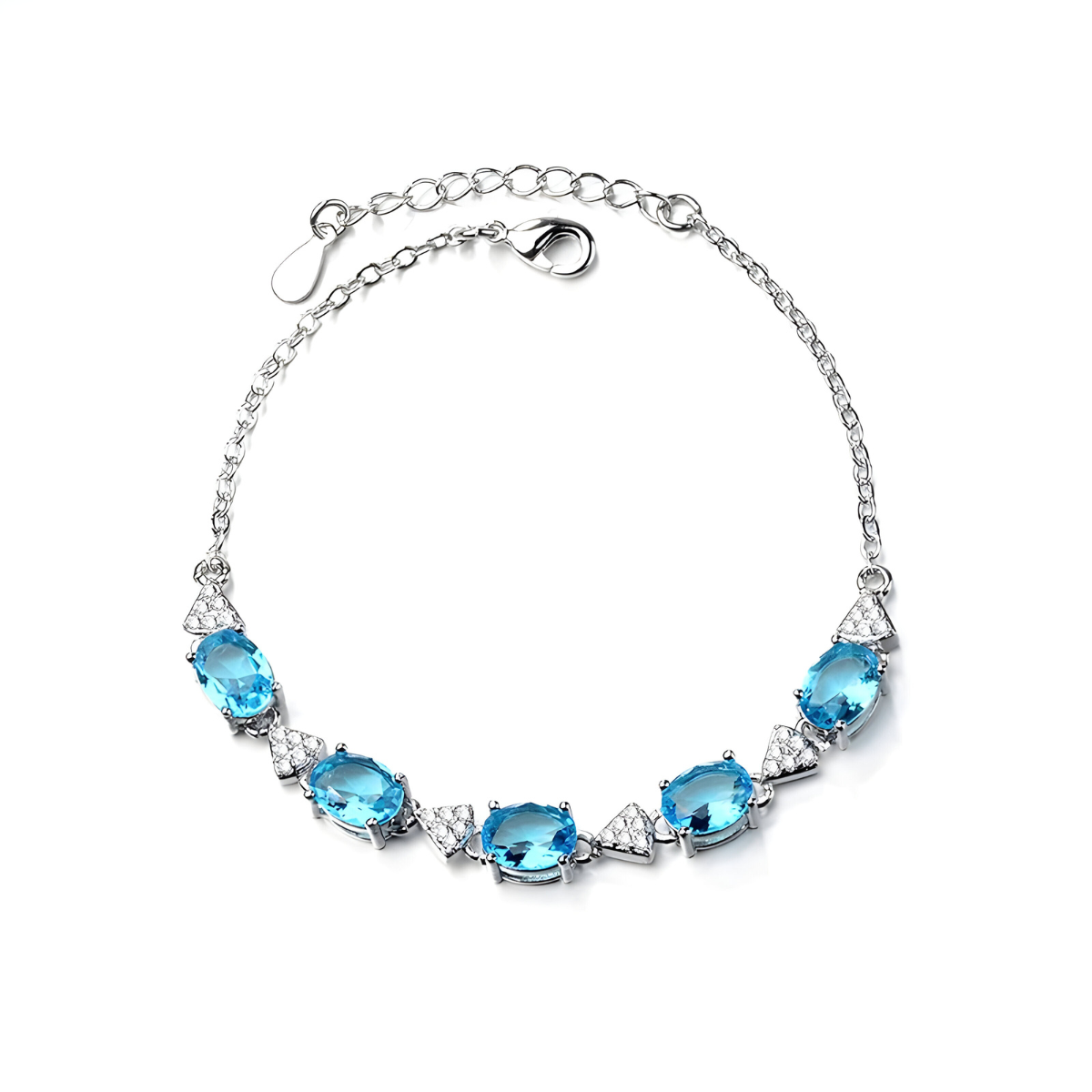 Bracelet aigue marine en argent orné de cinq pierres ovales bleues facettées entrecoupées d’éléments triangulaires sertis de cristaux