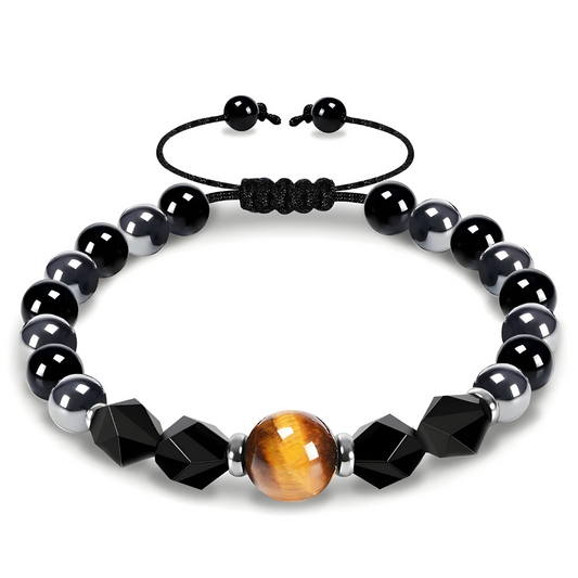 bracelet obsidienne composé de perles noires lisses et facettées, d’une perle centrale œil de tigre et d’un cordon noir à nœud réglable