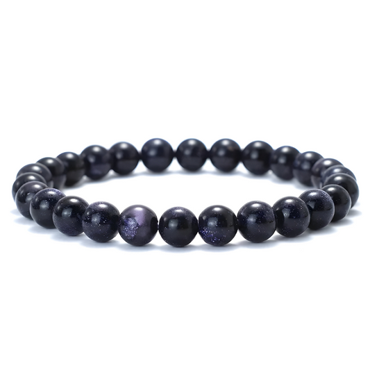 bracelet obsidienne composé de perles rondes noires avec éclats scintillants et reflets violets effet galaxie