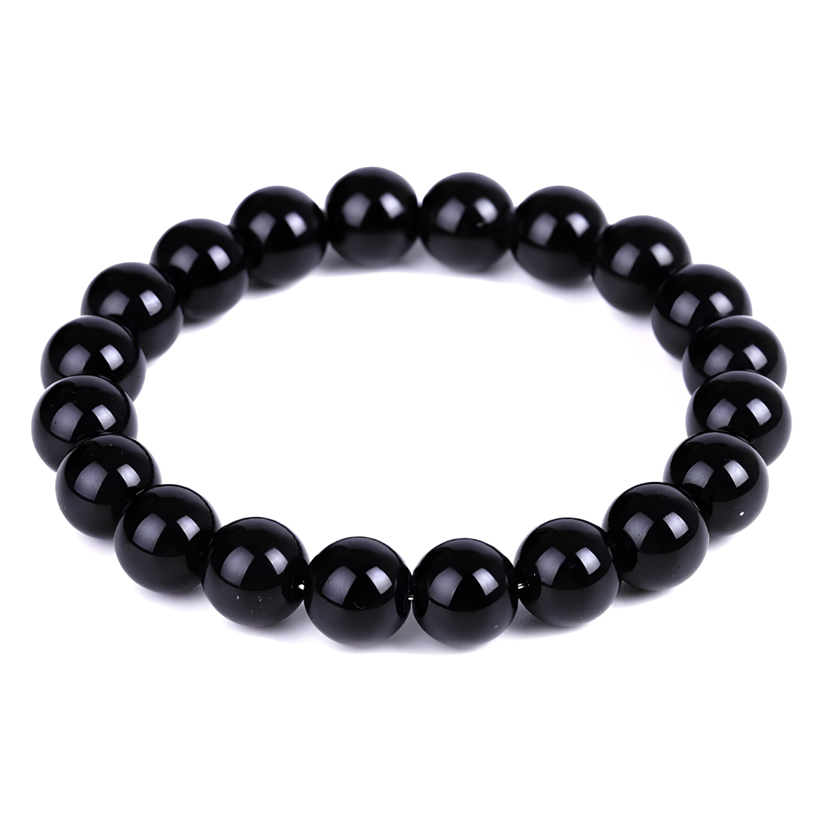bracelet obsidienne composé de perles rondes noires polies montées sur un fil élastique formant un cercle uniforme