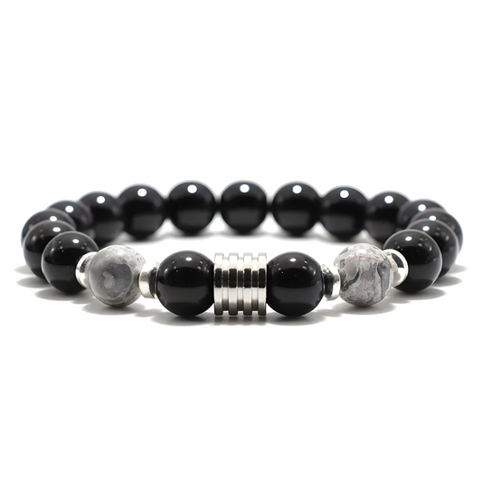 bracelet obsidienne avec perles noires brillantes et perles grises mouchetées, séparateur central en métal argenté strié et intercalaires argentés