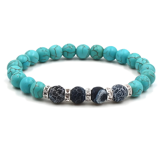 bracelet turquoise avec perles rondes bleu clair et perles noires veinées entourées d’intercalaires argentés ornés de petits cristaux