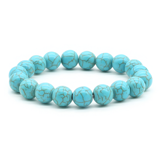 bracelet turquoise composé de perles rondes bleu clair marbrées de veines sombres formant un cercle régulier sur élastique