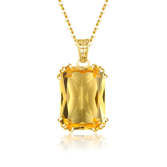 Une fine chaîne dorée porte un pendentif goutte en citrine naturelle translucide fixé par un motif spiralé orné d’une petite feuille stylisée, collier Citrine