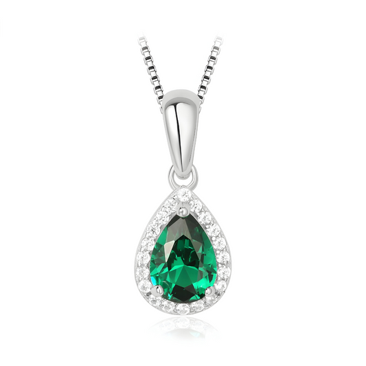 Pendentif en forme de goutte serti d'une pierre verte facettée entourée de petits oxydes blancs