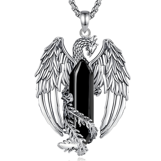 Collier obsidienne orné d’un cristal noir allongé enserré par un phénix argenté aux ailes étendues et plumes finement ciselées
