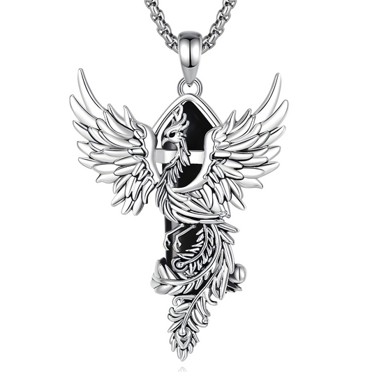 Collier obsidienne avec pendentif en forme de phœnix argenté aux ailes déployées, entourant une pierre noire allongée