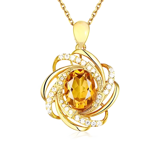 Une fine chaîne dorée porte un pendentif goutte en pierre naturelle de citrine translucide serti dans un motif spiralé en or, collier Citrine